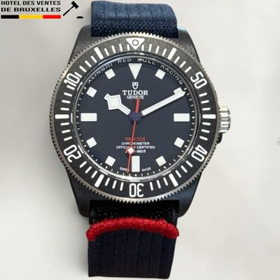 a black watch with a red second hand and a red second hand