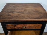 a small wooden table with a drawer on top of it