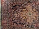 an antique persian rug on display in a museum