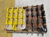 many different types of valves and fittings on the floor