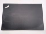 a black mouse pad on a white surface