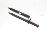a knife that is laying on a table