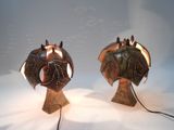 two lamps that are sitting on a table