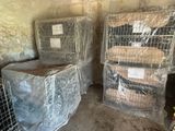 two cages that are sitting next to each other in a room