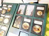 a lot of pictures on a table with a book on it