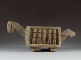figurine of a group of people in a cart