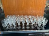 a lot of wine glasses sitting on a table