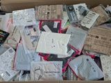 a cardboard box filled with many different types of electronic devices