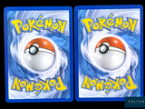 two packs of pokemon cards with a red and white ball