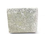a stone block sitting on a white surface