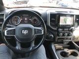 the interior of a car with a steering wheel and dashboard controls