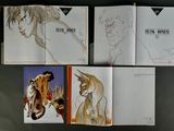 several drawings of a cat and a cat sitting on top of a book