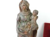 a statue of a woman holding a child in her arms