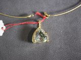 gold plated necklace with green amethorate pendant and red string