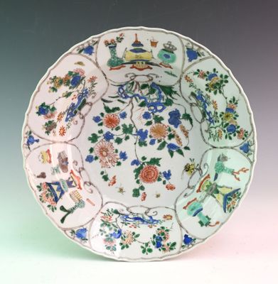 a plate with a bird and flowers design on it