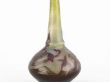 a vase that is sitting on a white surface