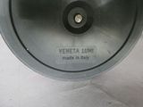 a close up of a metal bowl with a label on it