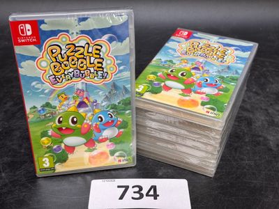 beaucoup de jeux Nintendo posés sur la table, avec une étiquette de prix