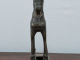an image of a statue of a cat on a wooden table