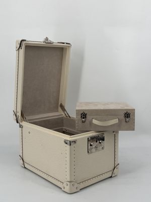an open suitcase sitting on top of a white surface