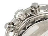 a close up of a watch on a white surface