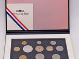 an image of a box of coins sitting on top of a table