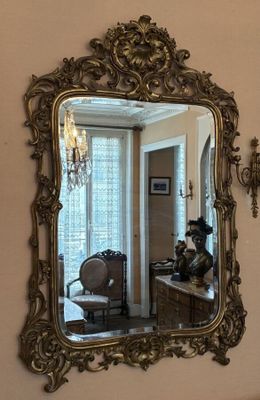 a mirror hanging on the wall in a room