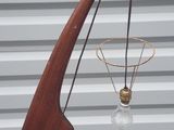 a sculpture of a basketball hoop and a basketball net
