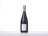 the bottle of champagne is sitting on the table with a white background