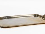 an antique brass tray with handles and handles on a white background