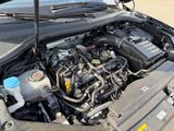 a car engine with its hood open on the street