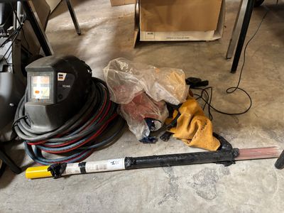 a picture of a vacuum and other tools on the floor