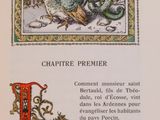 an old book with a picture of a dragon and a bird on it