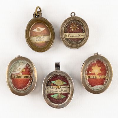 four different types of pendants are shown on a white surface
