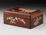 a small wooden box with a bird and flowers on it