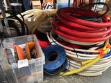 many different types of hoses on the floor
