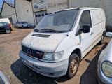 a white van that is parked in a parking lot