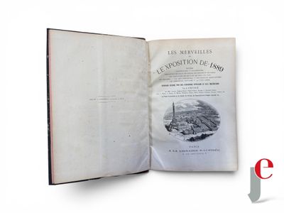 an open book with a picture of a city in it