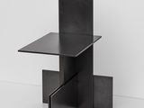 an image of a black side table with a drawer in the middle