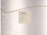 an old photo of a business card on a refrigerator