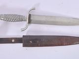 two knives that are laying next to each other on a table