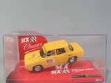 a yellow toy car in a clear box on a white surface