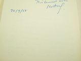 a piece of paper with writing on it sitting on a table