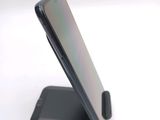 a close up of a cell phone on a stand