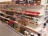 many shelves in the store that have various types of food on them