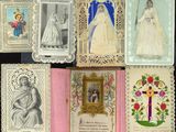 many cards with pictures of people on them on a table