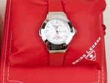 a red bag with a watch on top of it