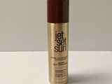 a close up of a bottle of hair spray on a table