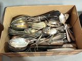 a box full of silverware sitting on a table