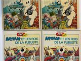 quatre bandes dessinées sont posées sur une surface blanche